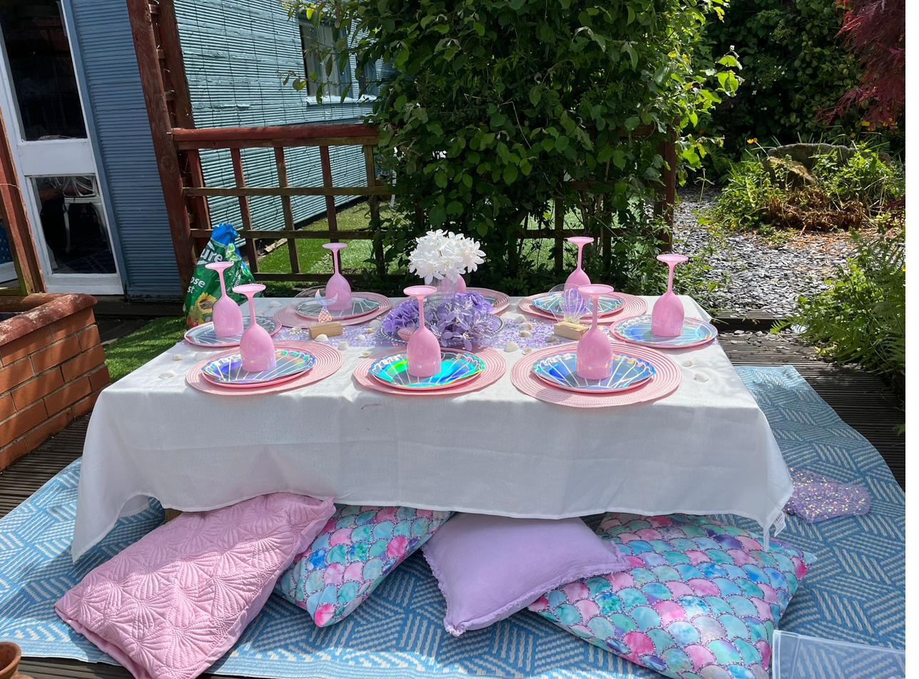 Mermaid themed party table set up outdoors in a Cheshire garden