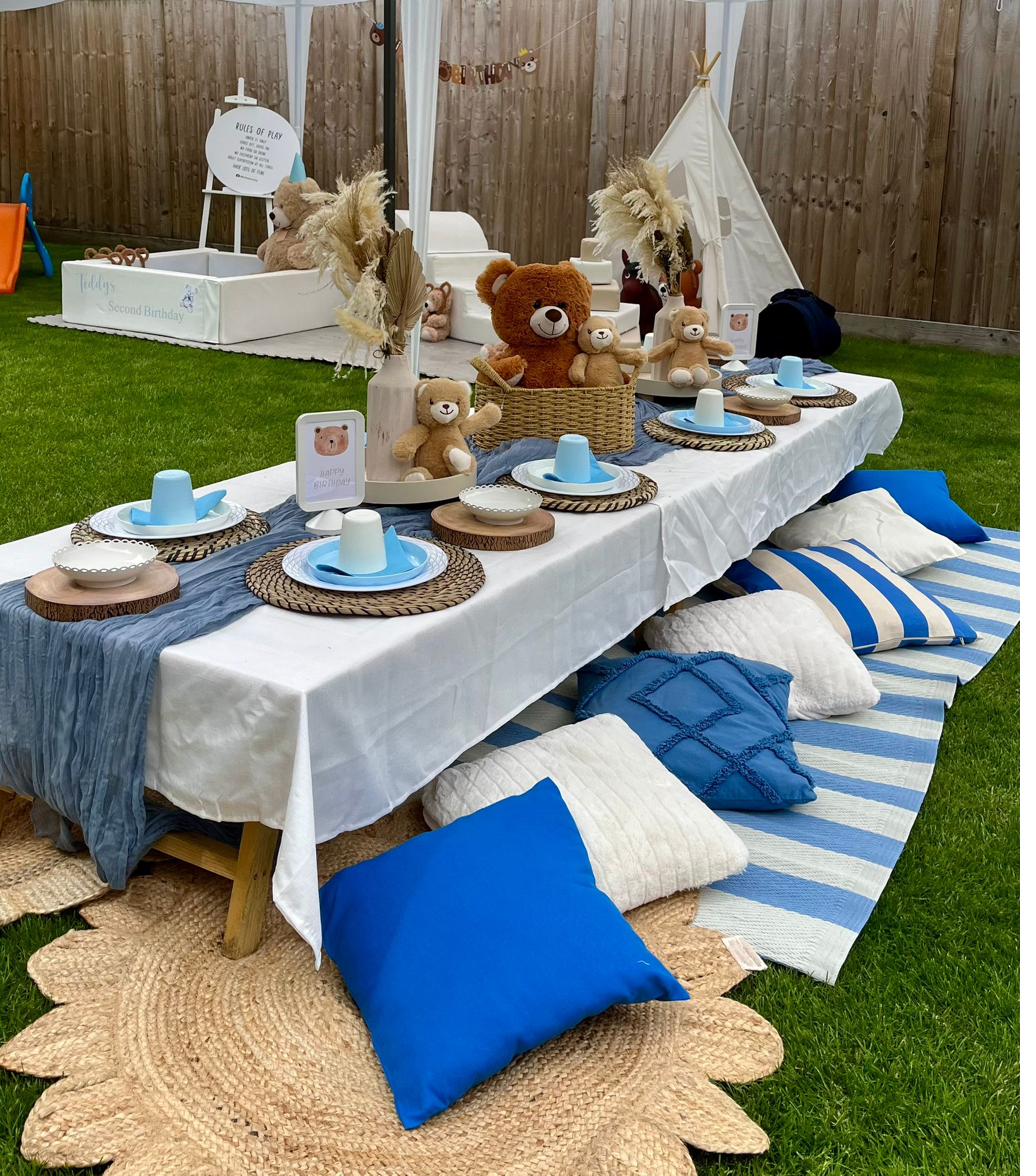 Picnic-style themed party table with decorative styling for a children's party