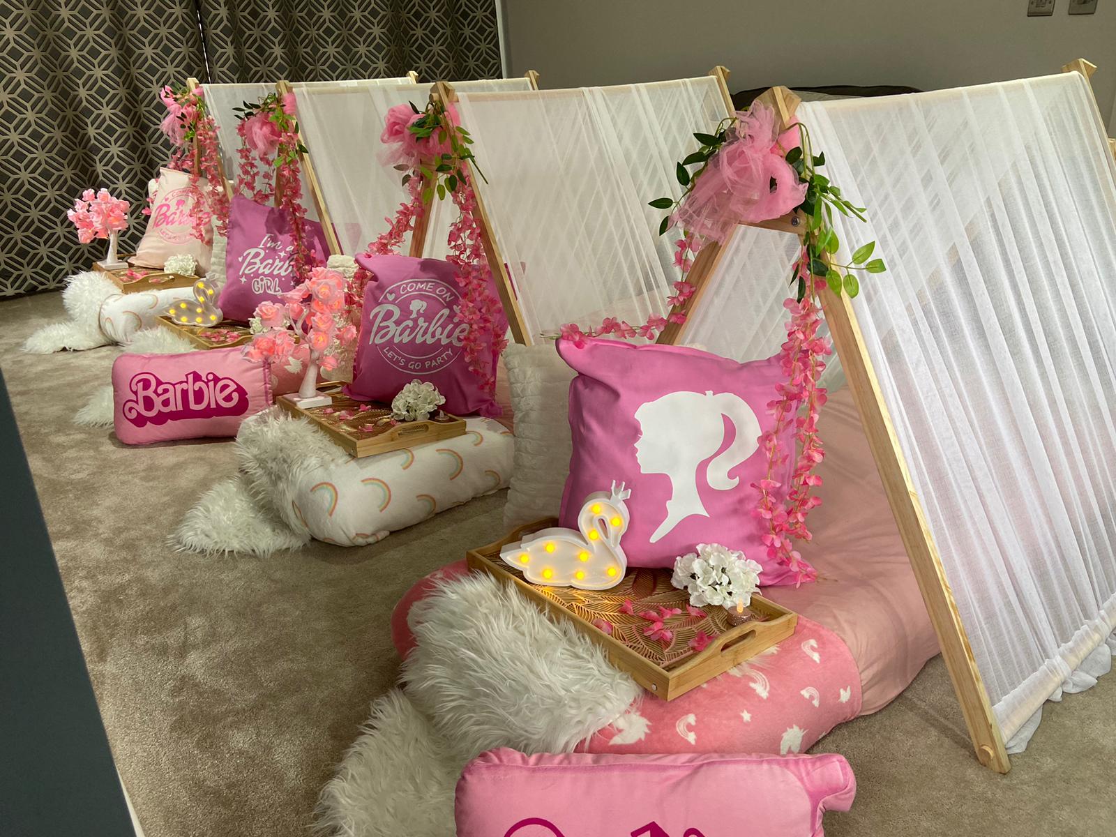 Barbie themed children's sleepover party with pink teepees and coordinated decorations