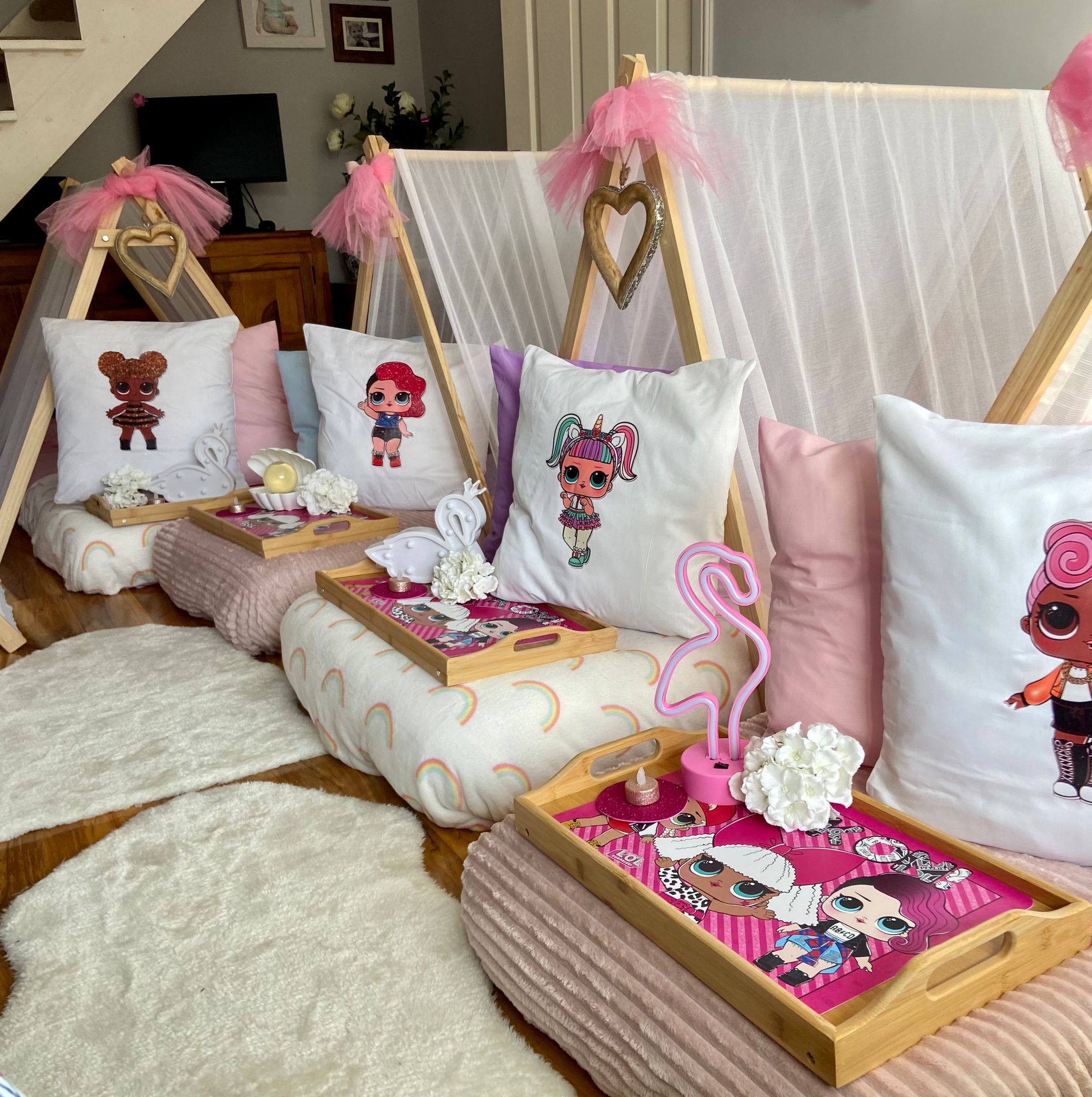 LOL Surprise themed pink teepees set up for a children's sleepover party