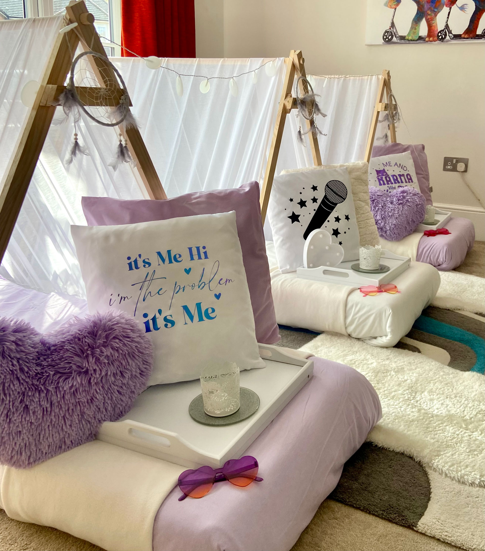 Taylor Swift themed lilac teepees set up for a children's sleepover party